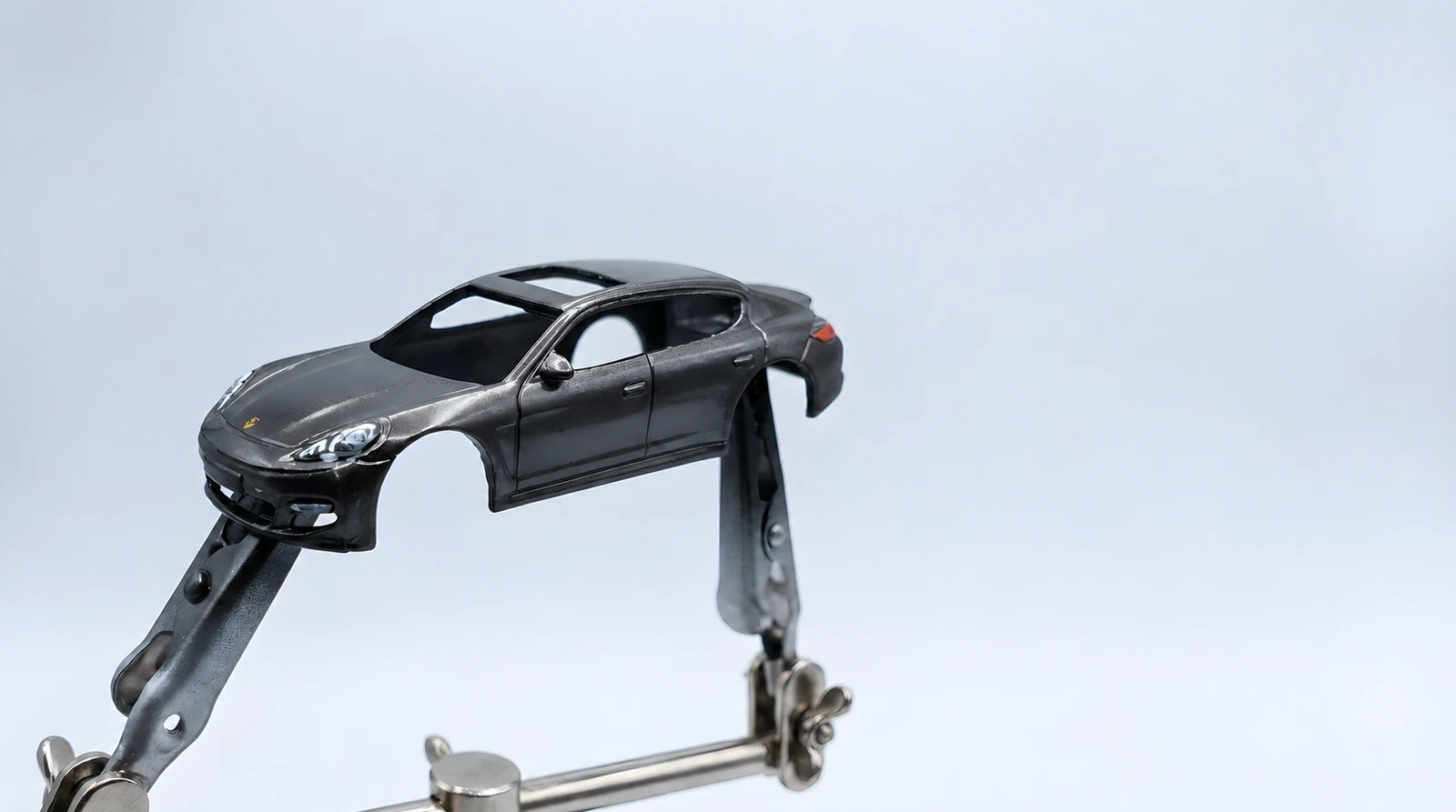 Porsche model car body mounted on holders in the Dioramax workshop